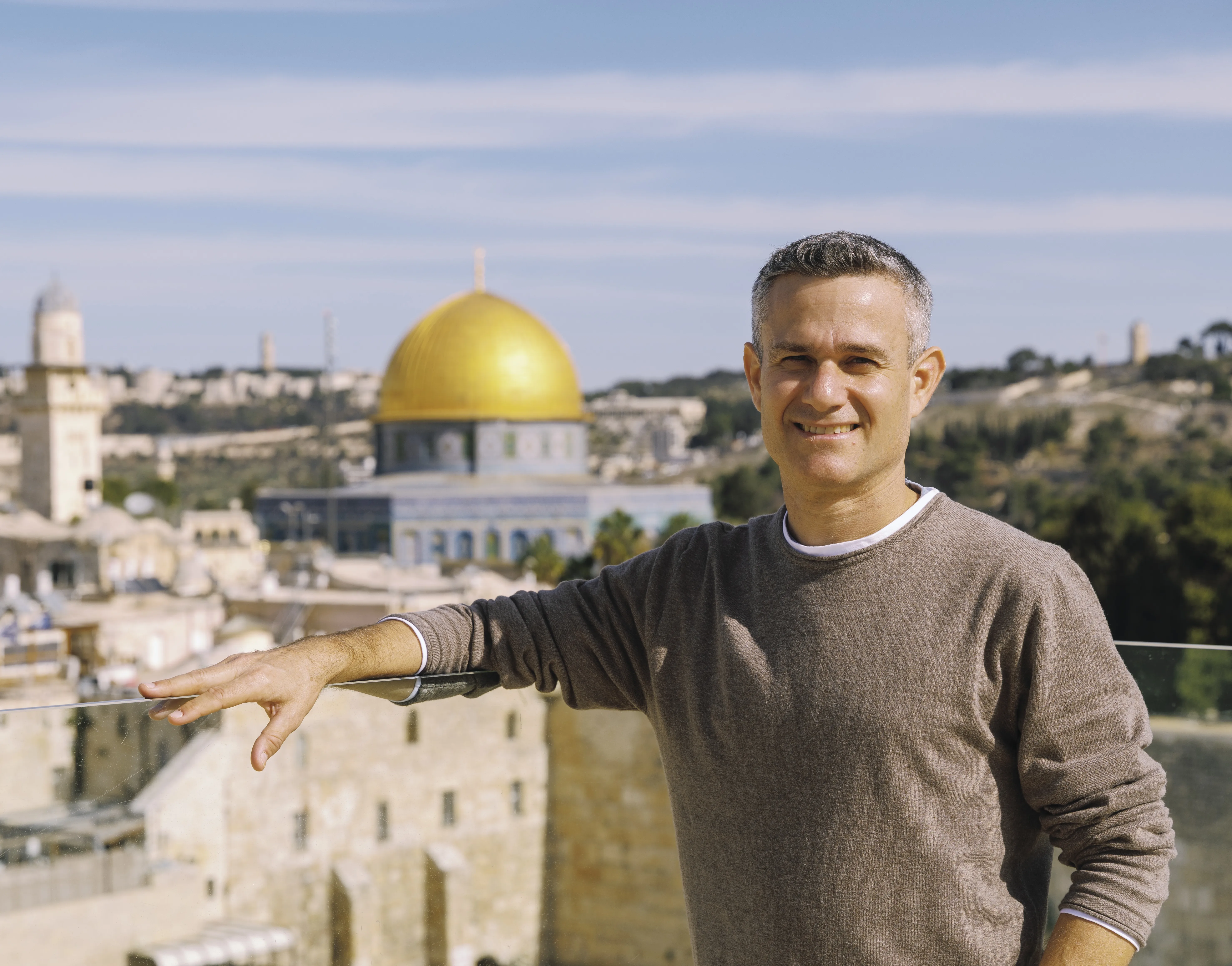Ran Frenkel, private Israel tour guide, with Jerusalem's Old City and Dome of the Rock in the background
